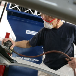 Sanding work being done in mobile paint prep station.